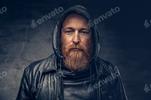 Preview: Redhead bearded male in leather jacket.