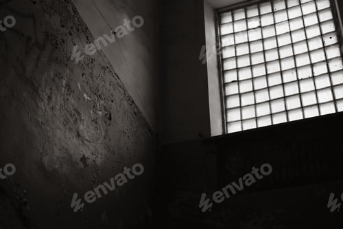 Preview: Entrance with large panoramic window of an abandoned old building, cracked paint on wall inside room