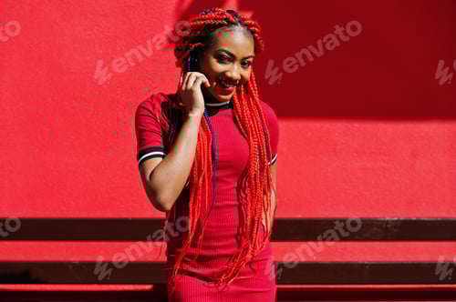 Preview: African american girl in red dress with dreadlocks