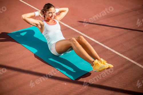 Preview: Young woman taking exercise