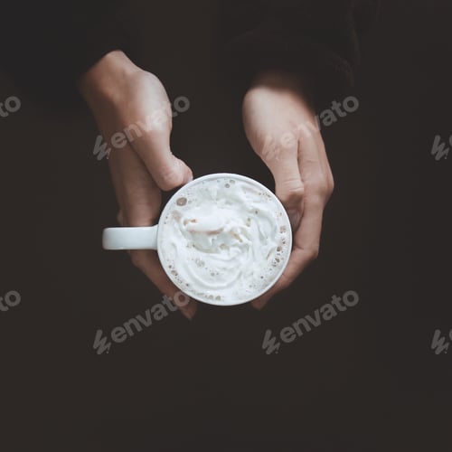 Preview: Hands Holding Mug Filled with Whipped Cream