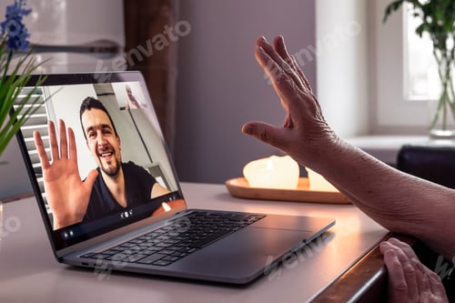 Preview: An old woman communicates with her son via video link through a laptop.