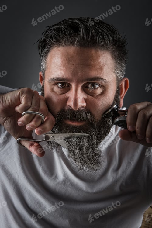 Preview: Expressive barber cutting beard