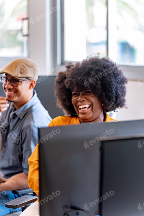 Preview: Happy businesswoman smiling while working in the office.