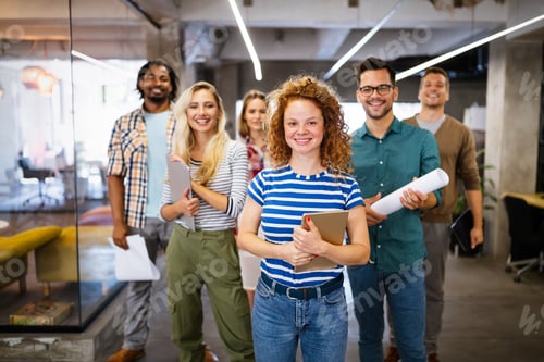 Preview: Group of successful business people designers architects in office
