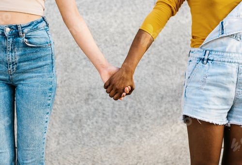 Preview: Two multiracial women holding hands