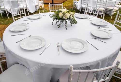 Preview: Beautiful outdoor wedding decoration in city. Candles and dried flowers and accessories with