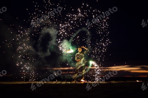 Preview: A girl lights a sparkler on the beach at dusk.