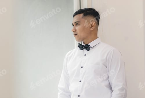 Preview: Close up of asian mana with white clothes