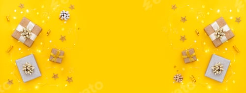 Preview: banner composition decor gifts christmas lights on a yellow bright background top