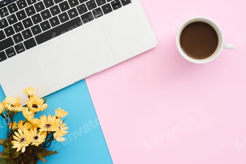 Preview: Top view office desk with laptop and coffee cup on blue pink color background.