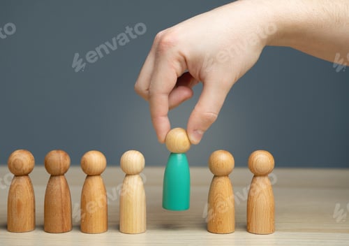 Vista previa: The hand selects a person from a business team.