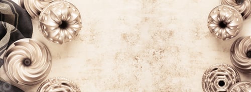 Preview: Light brown concrete texture with cotton kitchen napkin or towel and bakeware over. Abstract backgro