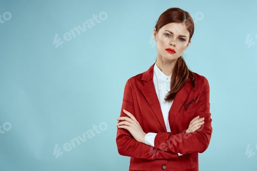 Preview: Elegant woman in red jacket bright makeup lips self-confidence cropped view blue background