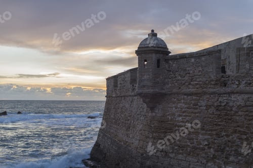 Preview: Beautiful sunset on Cadiz coastal fortification in Province of Andalucia, Spain