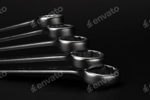 Preview: Wrenches on black background