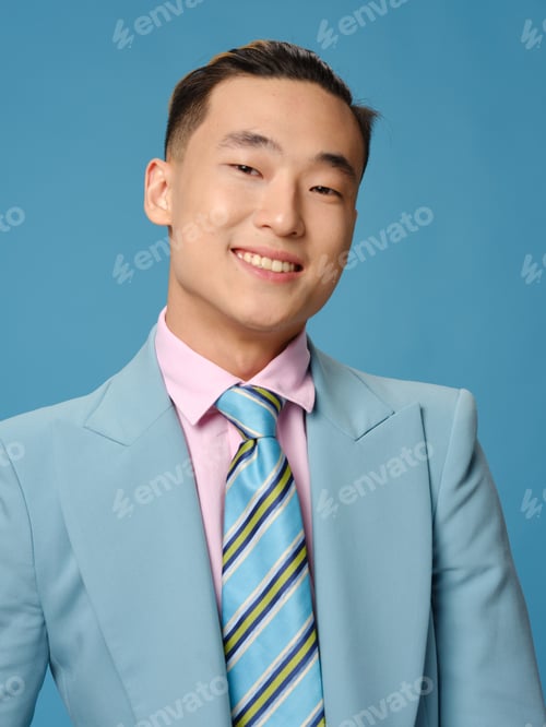 Preview: Handsome young man in suit smiling Asian appearance business finance portrait