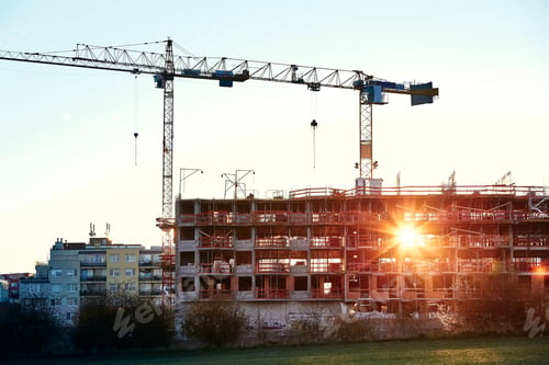 Preview: Construction site with cranes at the amazing sunrise. Construction of the new residential building.