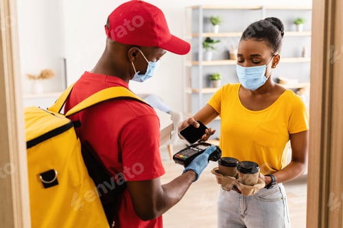 Preview: Lady Paying For Coffee And Pizza Delivery With Cellphone Indoor