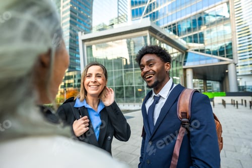 Preview: Diverse business professionals having cheerful conversation outdoors in city