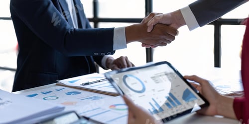 Preview: Shaking hand business leaders talk about charts, financial graphs showing results are analyzing and