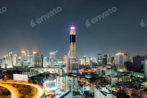 Preview: Aerial view landmark skyscraper building with traffic glowing on elevated road