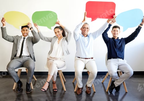 Preview: Shot of a group of businesspeople holding speech bubbles in an office at work