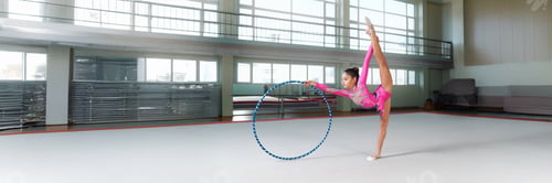 Preview: Rhythmic Gymnast Balancing with Hoop in Wide Banner