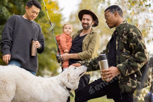Preview: Multiracial male friends rest in nature at autumn