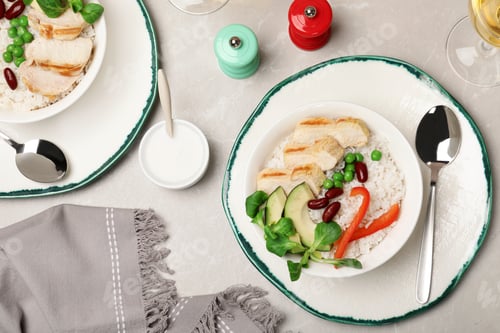 Preview: Boiled rice with vegetables and meat served on table, flat lay