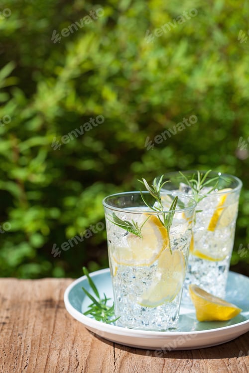 Preview: refreshing lemonade drink with rosemary in glasses