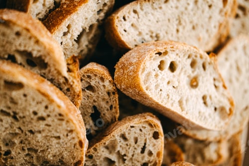 Preview: Fresh Sliced Wholegrain Bread in Bowl. Artisan bread low-in salt, sugar and fat