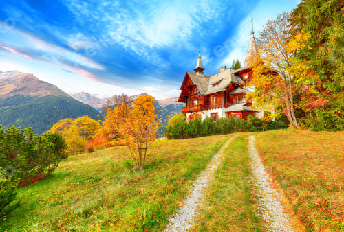 Preview: Fantastic autumn view of traditional swiss chalets in Wengen village
