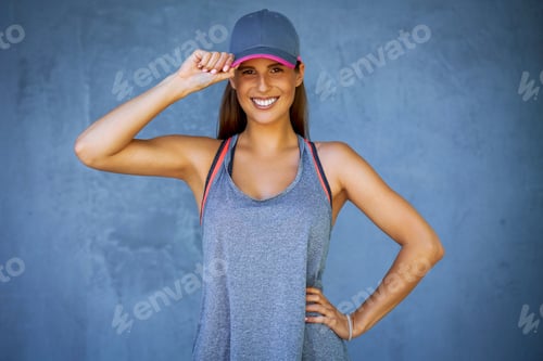 Preview: Female runner posing over gray background
