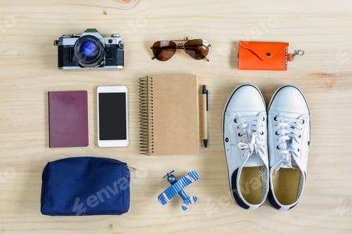 Preview: Outfit of traveler on wooden background
