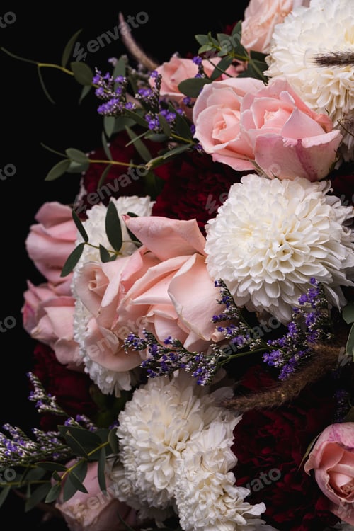 Preview: Vertical closeup shot of a luxurious bouquet of pink roses and white flowers on a black background