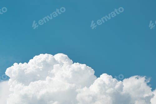 Preview: Lush white clouds against a clear blue sky at the bottom of the frame, copy space. Natural sky