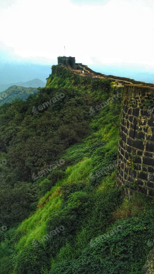 Scenic Hilltop Fortress With Greenery and Stone Walls