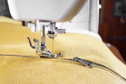 Preview: Modern Sewing Machine With Yellow Velours Fabric Close Up