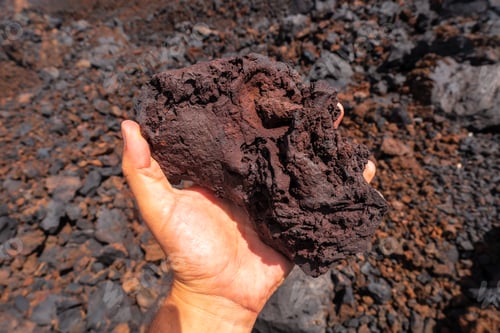 Preview: Detail of the red stones on the volcanic trail in the town of Tamaduste on the coast of El Hierro