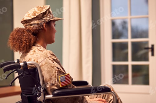 Preview: Injured Female American Soldier Wearing Uniform Sitting In Wheelchair Looking Out Of Window
