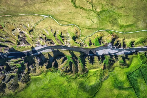 Preview: Rugged Fjadrargljufur canyon naturally eroded with river flowing in summer at Iceland