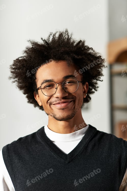 Preview: Young man radiating joy in a cozy modern home filled with warmth and happiness