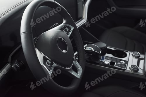 Preview: Interior of a prestigious modern black car. Leather comfortable seats and accessories and steering
