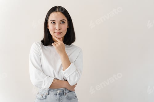 Preview: Beautiful brunette woman over isolated background with hand on chin thinking