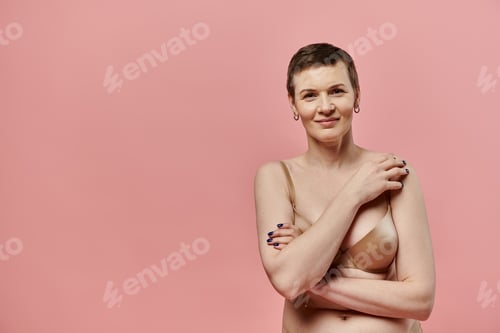 Preview: Woman poses for breast cancer awareness