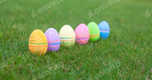 Preview: Multi-colored Easter eggs on green grass