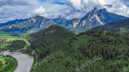 Preview: Aerial view of mountain landscape with river surrounded by dense trees