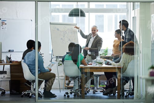 Preview: Brainstorming in progress. Shot of a group of coworkers in a boardroom meeting.