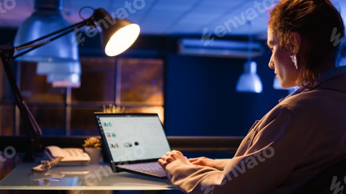 Preview: Office employee working with financial graphs report